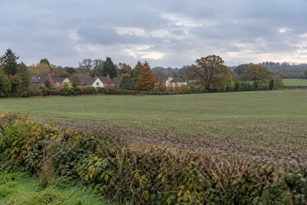 Stockton housing refusal represented by farmland beside an English village in Warwickshire